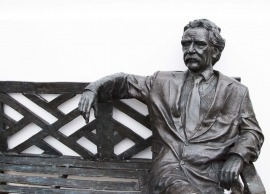 A Life-Size Bronze Statue of Einstein Sitting On A Bench